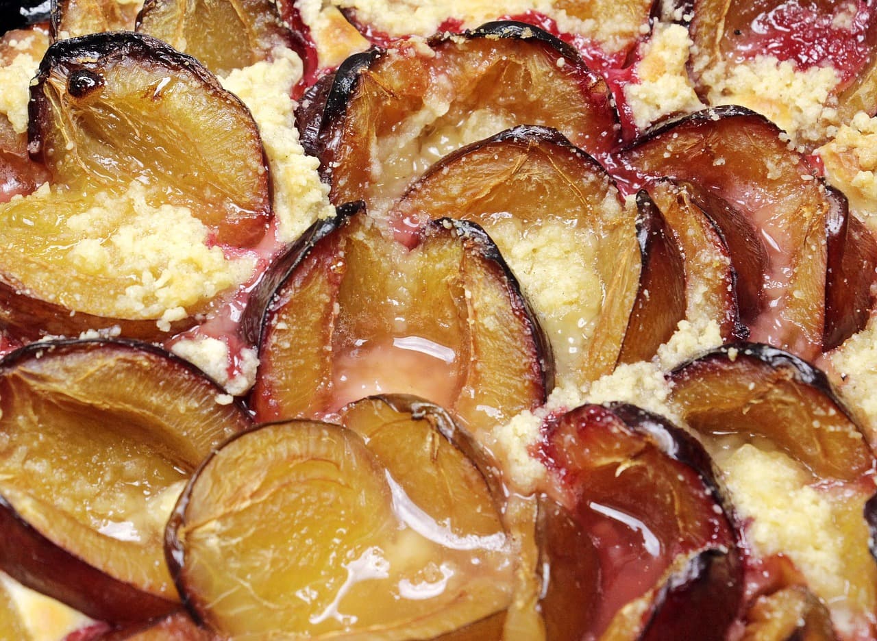 Close-up of a freshly baked plum crumble cake